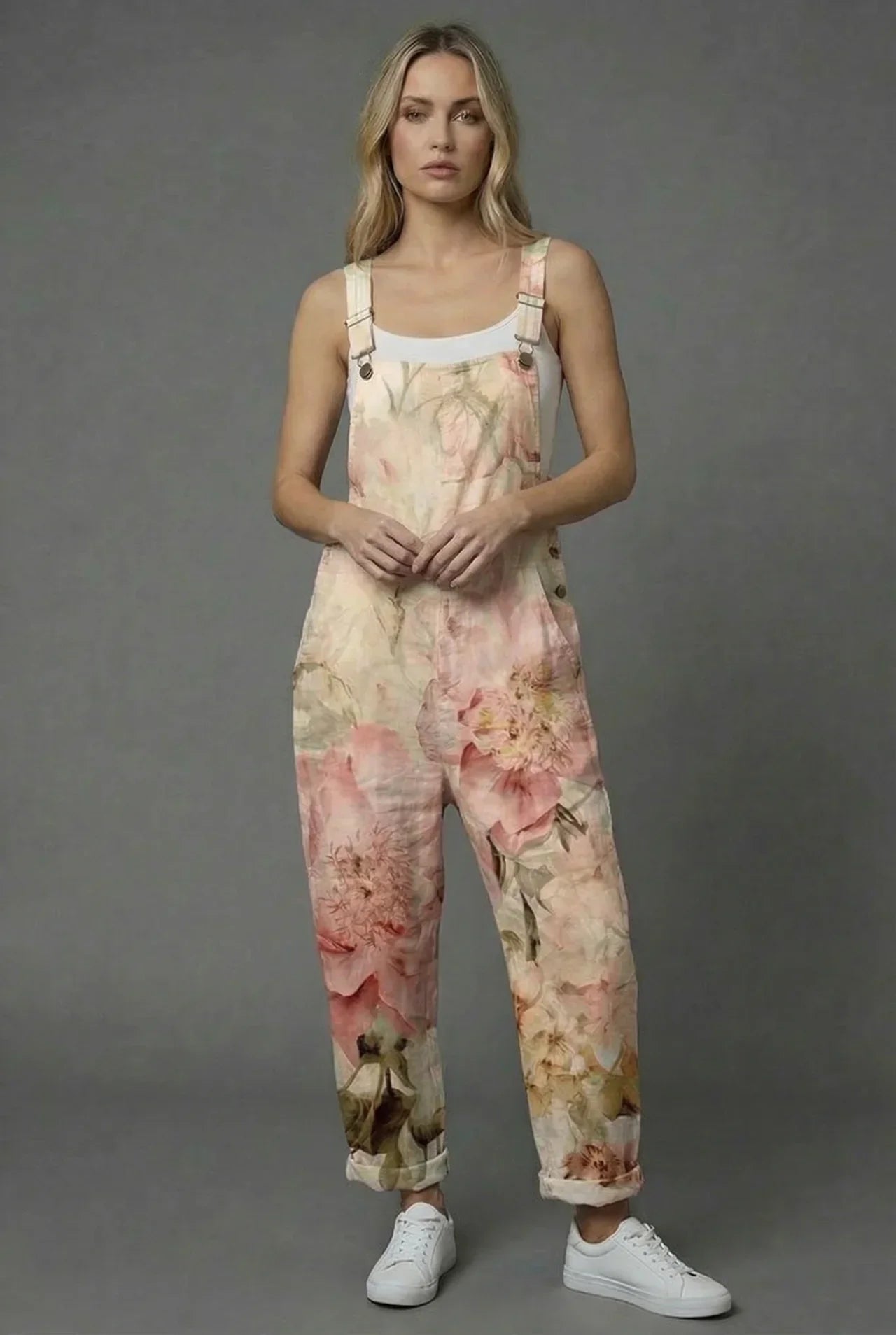 Green textured wide leg romper with raised floral details and a relaxed sleeveless fit