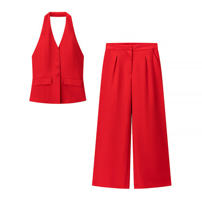Two-piece red halter top and wide leg pants set laid flat on white background