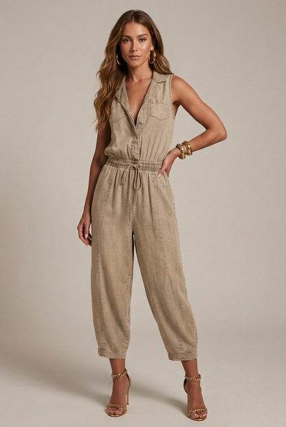 Beige sleeveless denim romper with pockets, drawstring waist, and tapered cropped legs