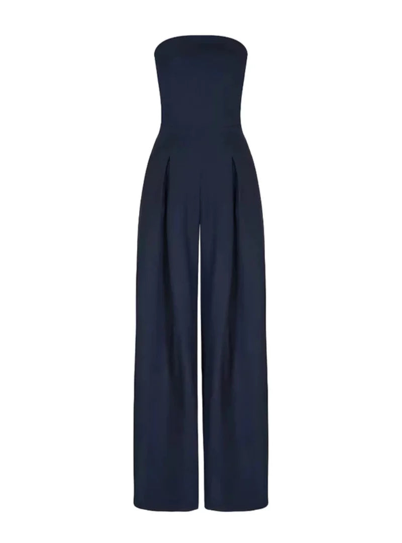 Front view of a navy strapless jumpsuit with pleated wide leg pants and clean neckline