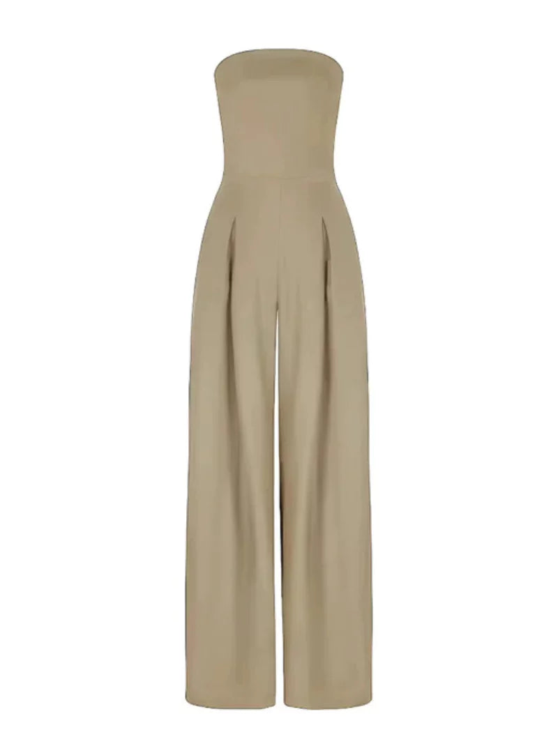 Taupe strapless wide leg jumpsuit with relaxed drape and side pockets on a model