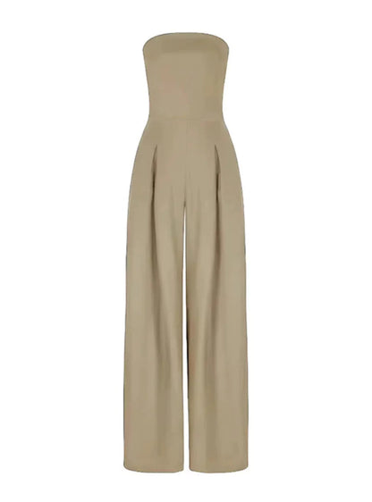 Taupe strapless wide leg jumpsuit with relaxed drape and side pockets on a model