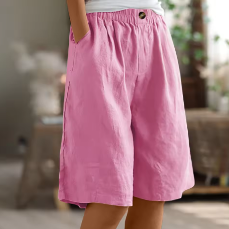 Pink women relaxed Bermuda shorts with elastic waist, soft drape fabric, button accent and pockets