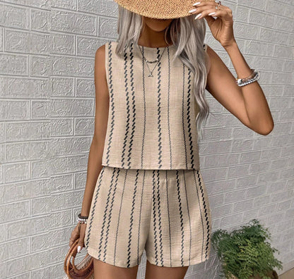 Beige printed sleeveless top and shorts set styled with straw hat, relaxed summer outfit