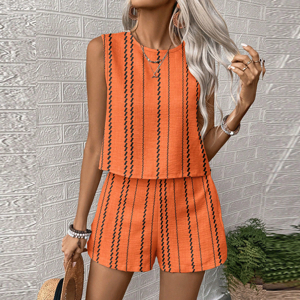 Orange printed sleeveless top and shorts matching set with black vertical stripe design, front