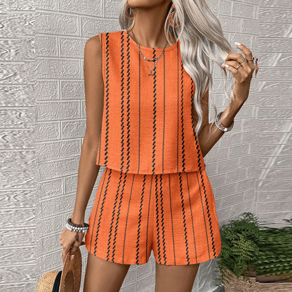 Orange printed sleeveless top and shorts matching set with black vertical stripe design, front
