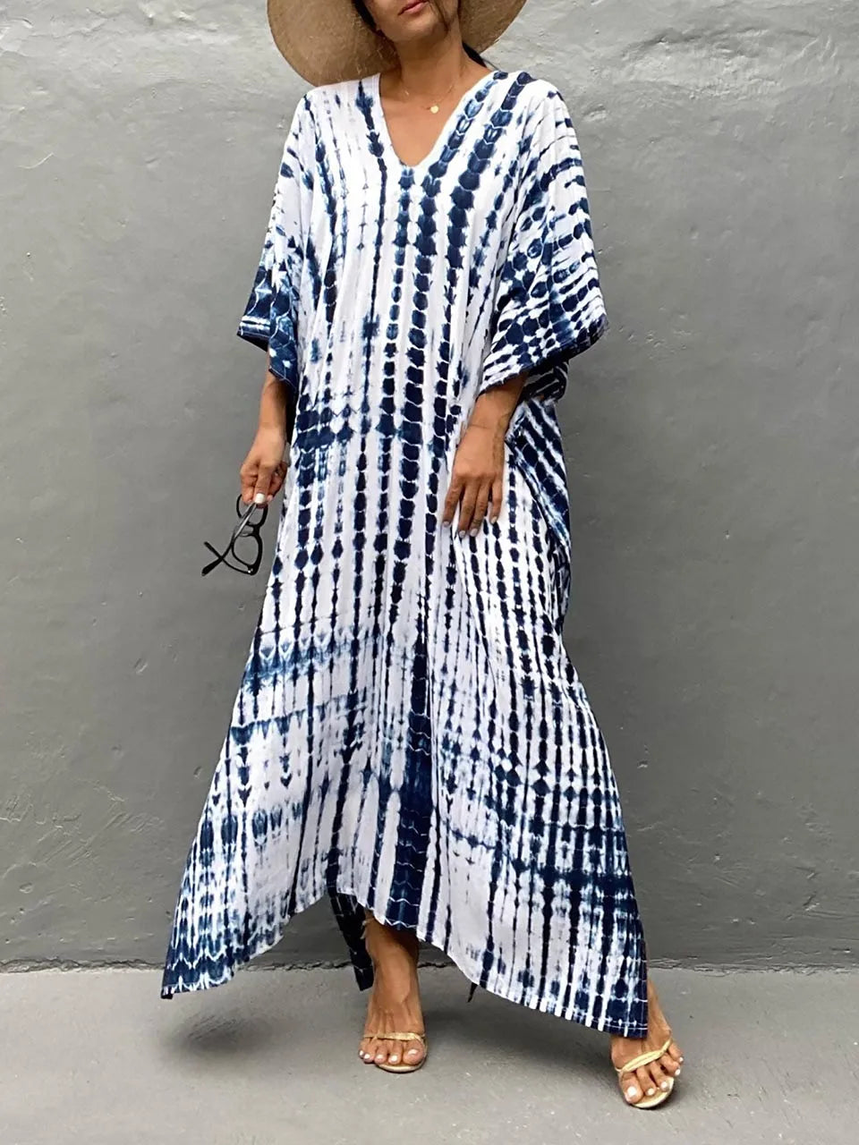 Blue and white tie dye maxi dress with V-neck, loose sleeves, and flowing hem