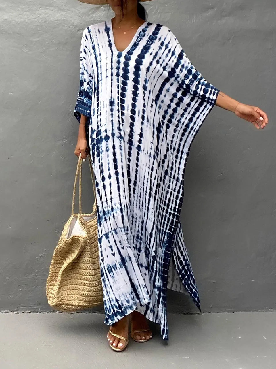 Blue and white tie dye summer dress with V-neck, wide sleeves, and side slit