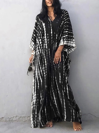 Black tie dye maxi dress with V-neck, flowing sleeves, and long loose silhouette