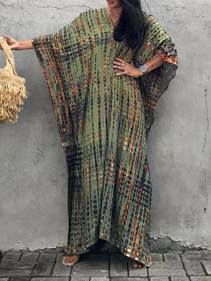 Olive green tie dye maxi dress with orange stripes, wide sleeves, and relaxed fit