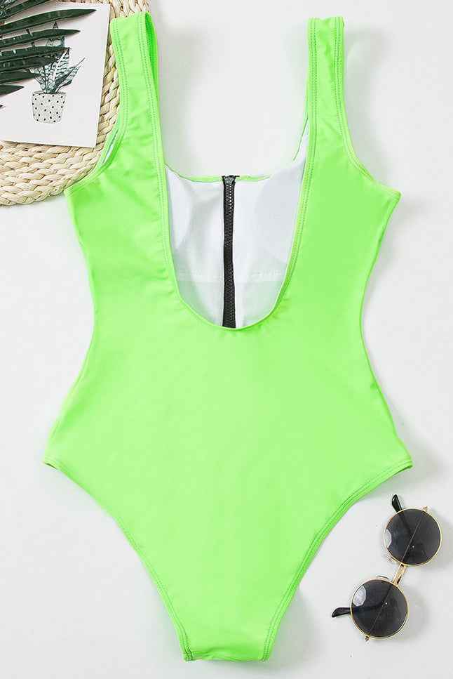Neon green one piece bathing suit laid flat with black zipper and wide shoulder straps