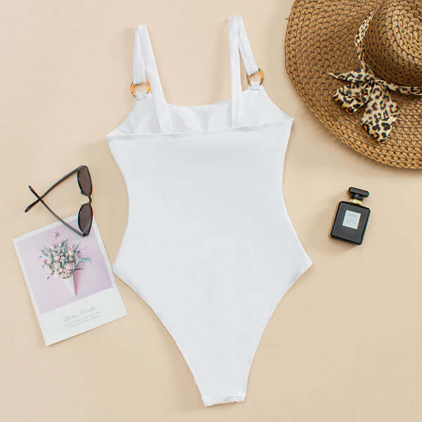 Back view of white one piece swimsuit with scoop back and high cut leg opening