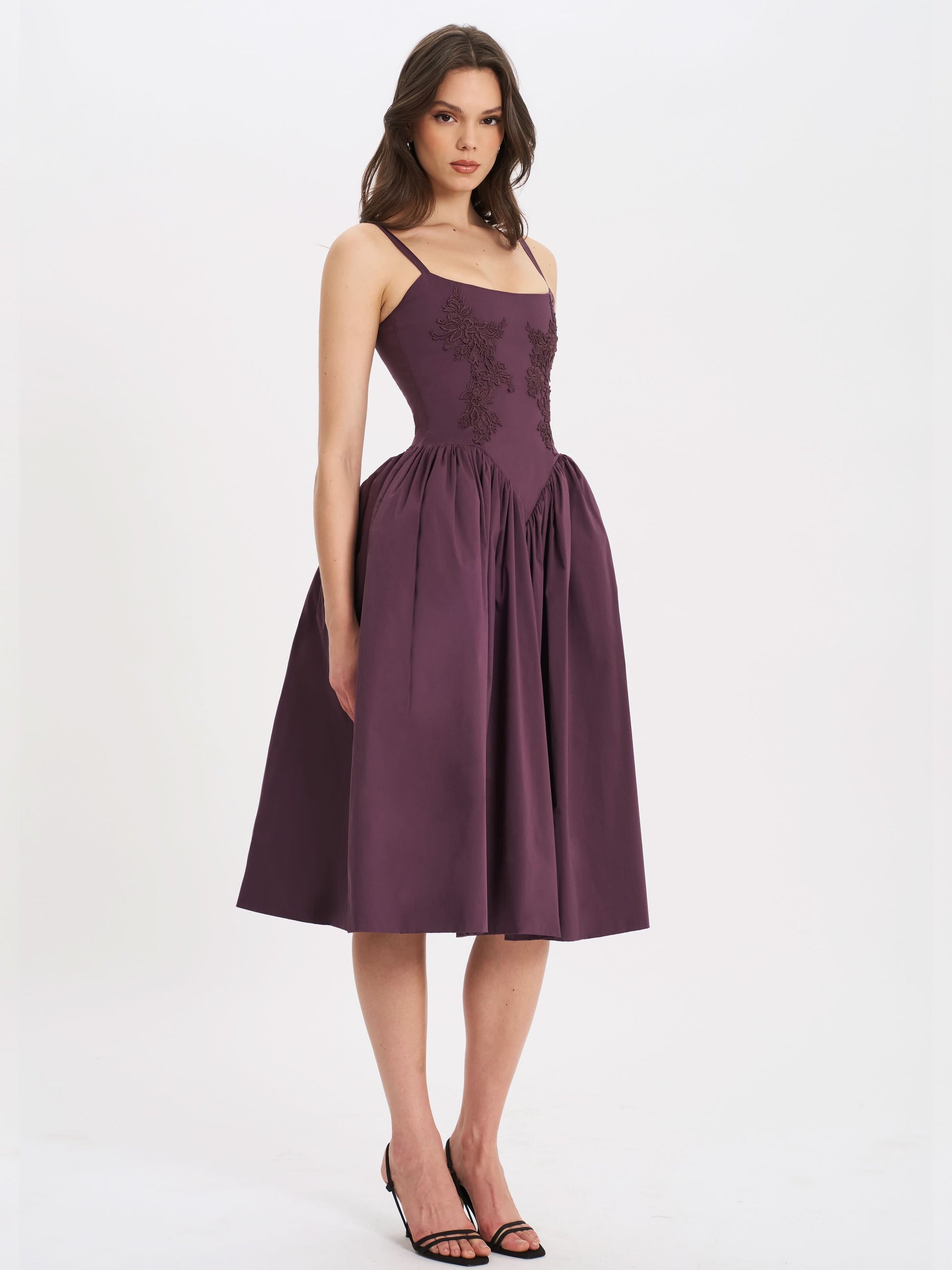 Front view of plum cocktail midi dress with floral embroidery and voluminous skirt