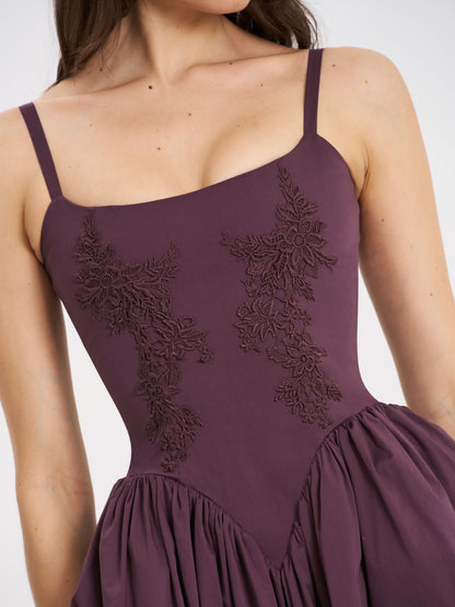 Close-up of embroidered bodice on purple cocktail midi dress with square neckline
