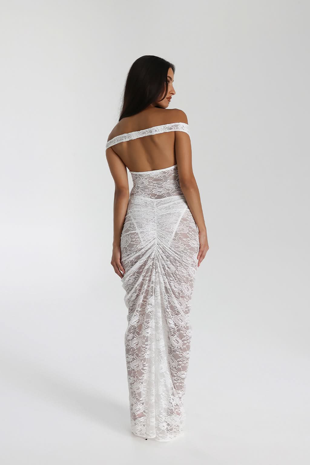 Close-up of black off shoulder lace maxi dress with deep neckline and sheer floral lace
