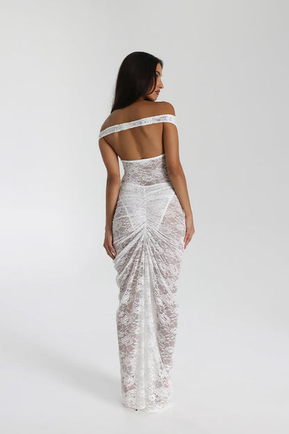 Close-up of black off shoulder lace maxi dress with deep neckline and sheer floral lace