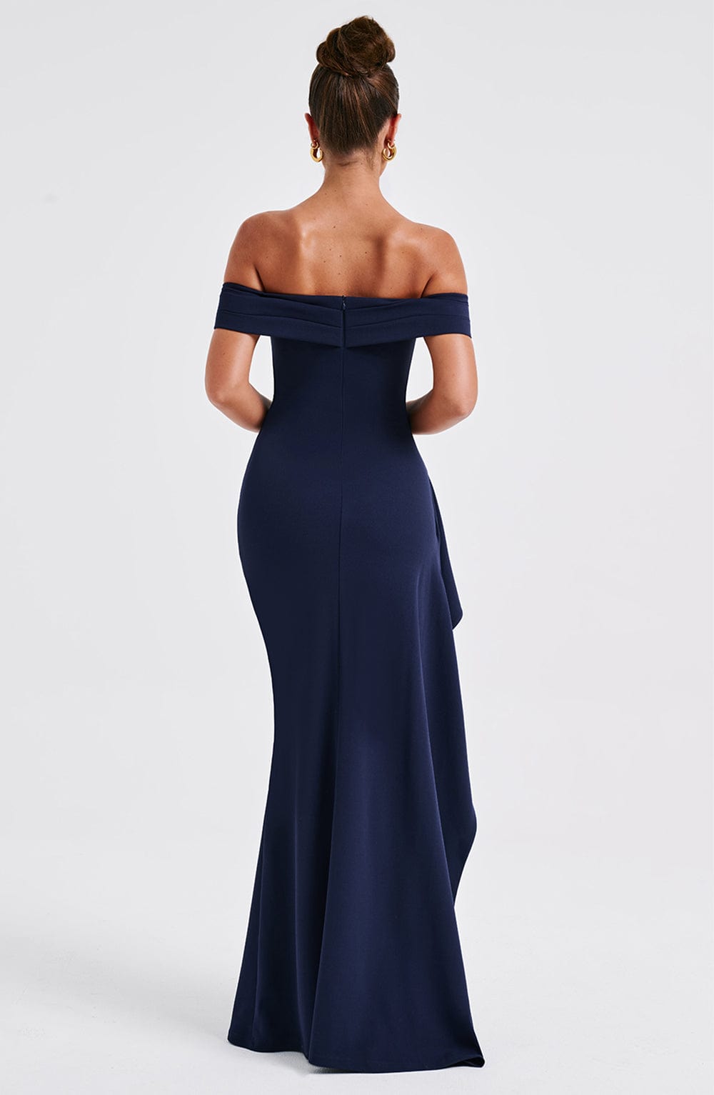 Back view of navy off shoulder maxi dress with open shoulders and long skirt