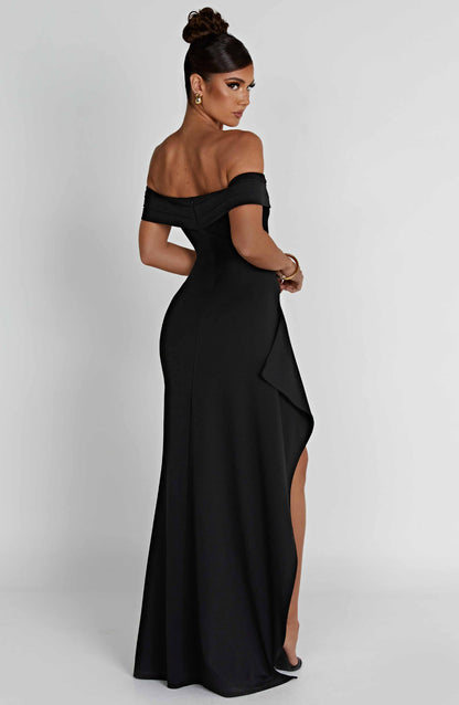 Back view of black off shoulder maxi dress with zip closure and smooth floor length skirt