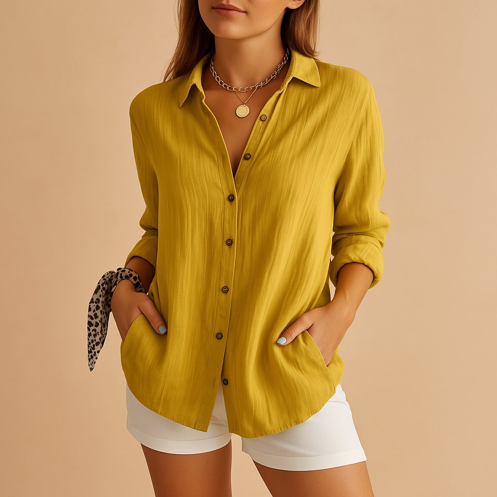 Mustard yellow linen button down shirt styled with rolled sleeves and white shorts