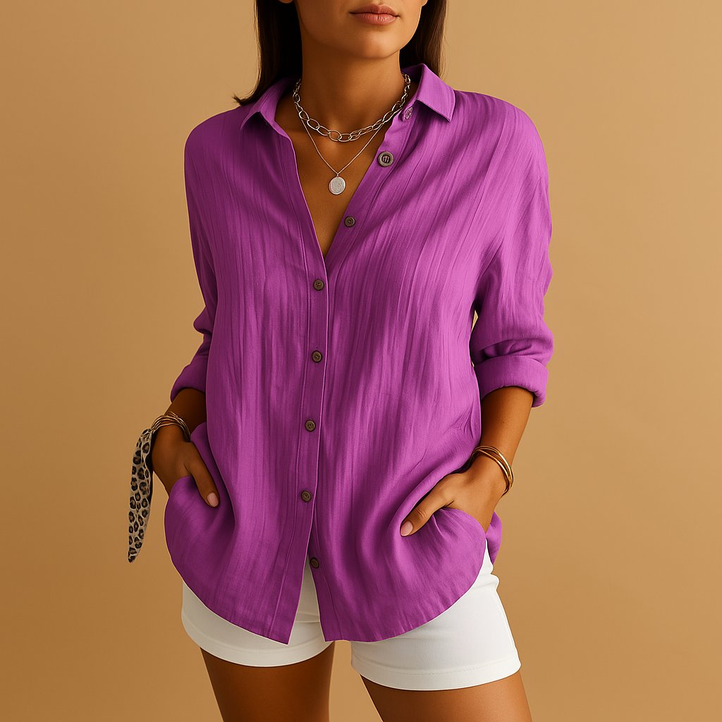 Purple linen button down shirt with rolled sleeves and relaxed summer style