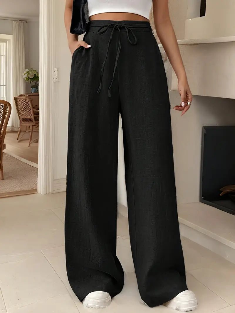Black women's high waisted linen pants with wide legs, adjustable drawstring, and loose fit
