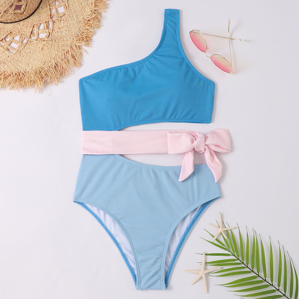 Blue ribbed one shoulder one piece swimsuit with pink wrap tie and cutout waist