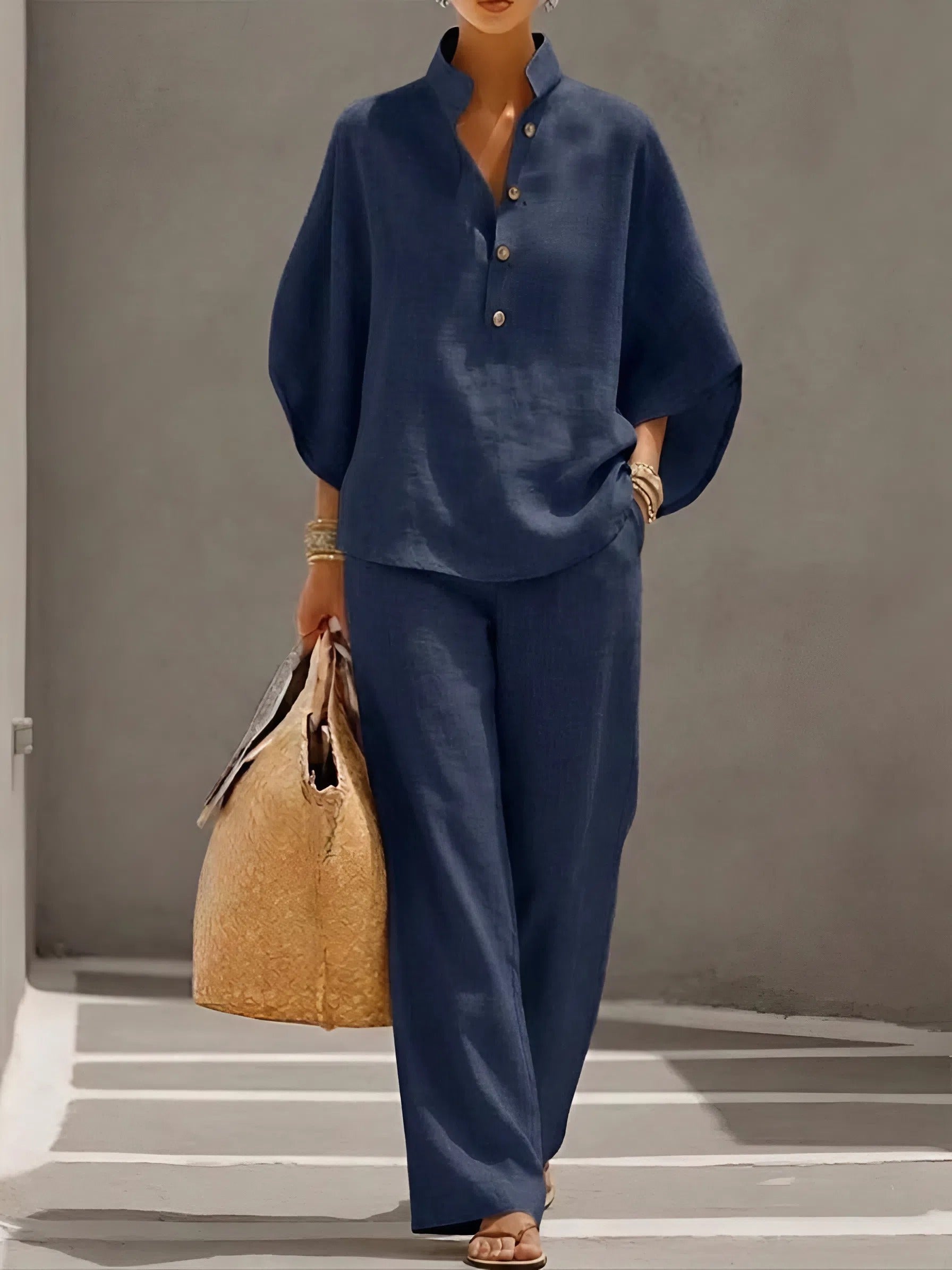 Navy blue two piece set with stand collar button up top and wide leg pants