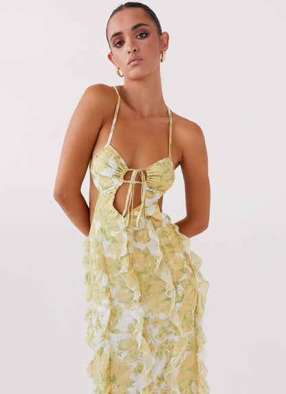 Close-up of floral maxi dress bodice with tie front, cutout detail, and delicate spaghetti straps