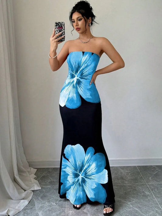 Woman wearing blue floral strapless maxi dress with black skirt and large flower print