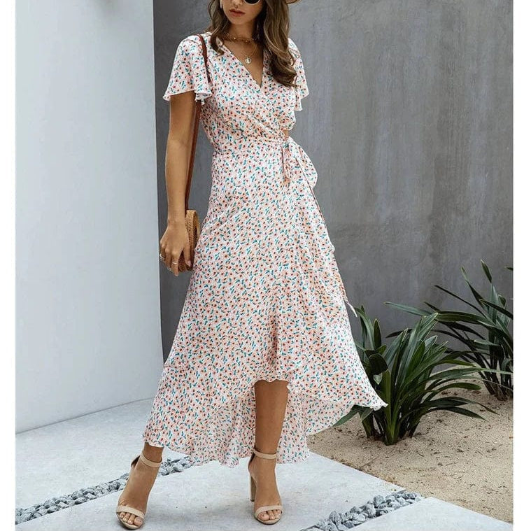 Pink floral V neck midi dress with flutter sleeves, wrap waist tie, and high-low hem