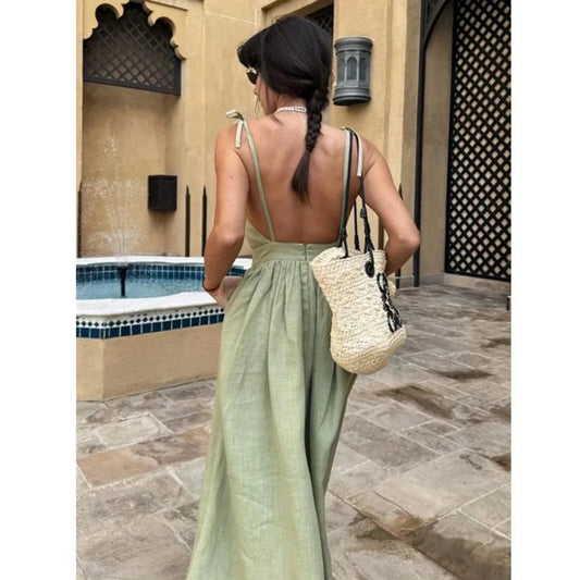 Back view of sage green linen maxi dress with open back and tie shoulder straps