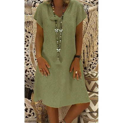 Olive green women's summer linen mini dress with V neck, short sleeves, and soft drape