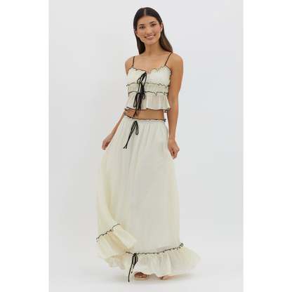 Cream maxi skirt set with black trim and tie-front crop top, front view on white background