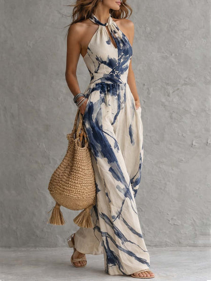 Side angle cream and navy abstract print halter neck wide leg jumpsuit, flowy summer fit