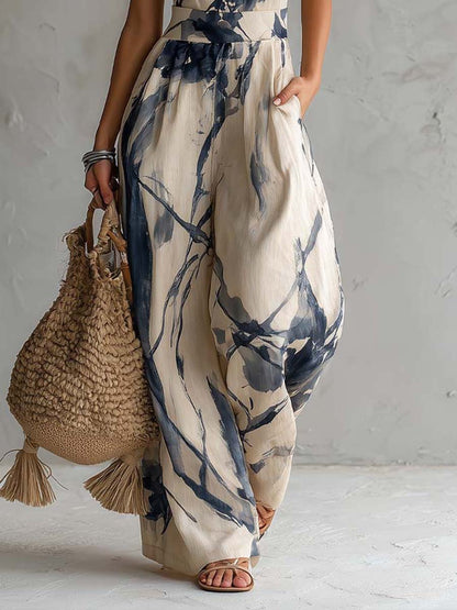 Detail of wide leg pants and pocket on cream navy printed jumpsuit, lightweight summer style