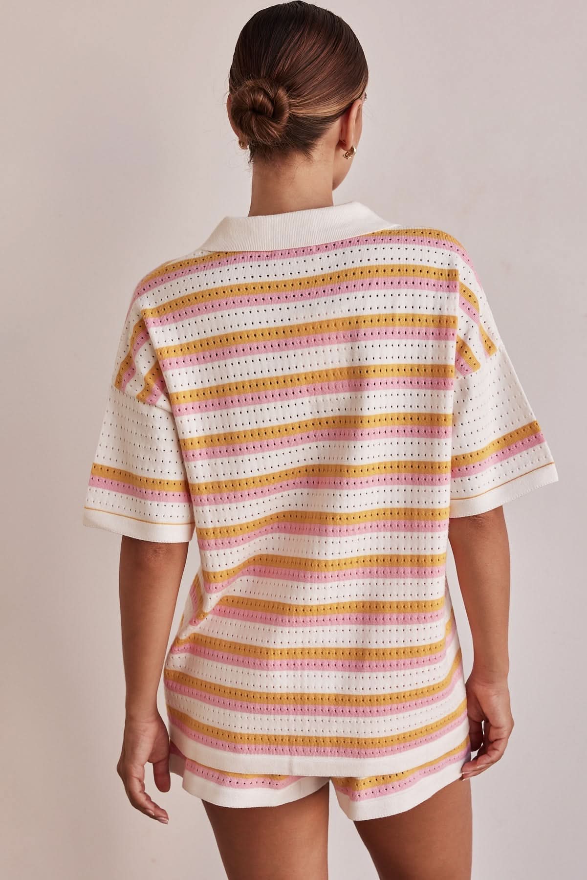 Back view of women's summer striped knit shorts set with short sleeve collared top