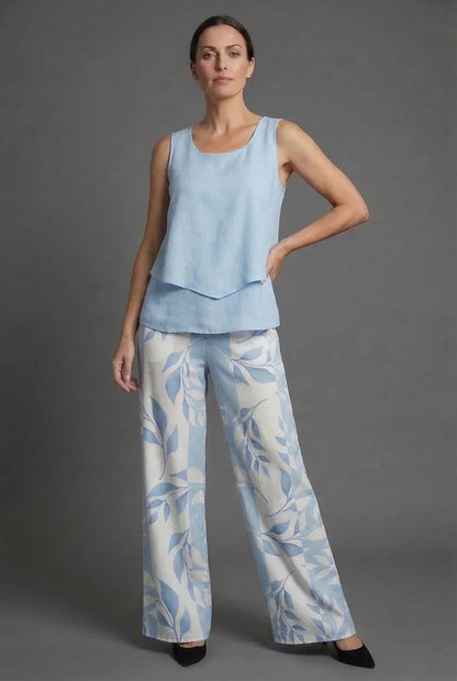 Front view of light blue sleeveless top and matching wide leg floral pants co ord set