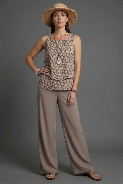 Beige sleeveless patterned top with loose wide leg linen pants and straw hat co ord set
