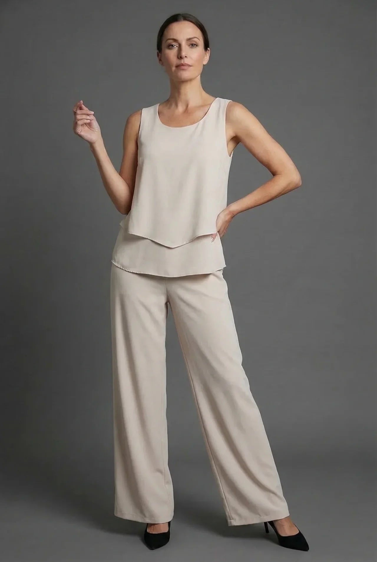 Beige sleeveless top with matching wide leg pants in a neutral summer co ord set
