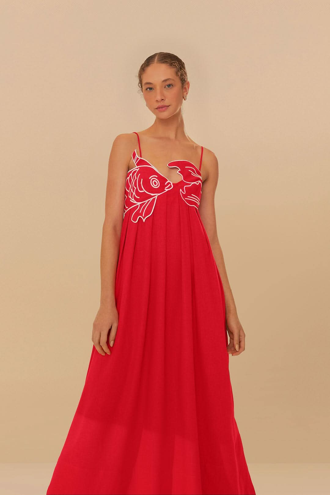 Front view of red fish print maxi dress with V neckline and relaxed summer style