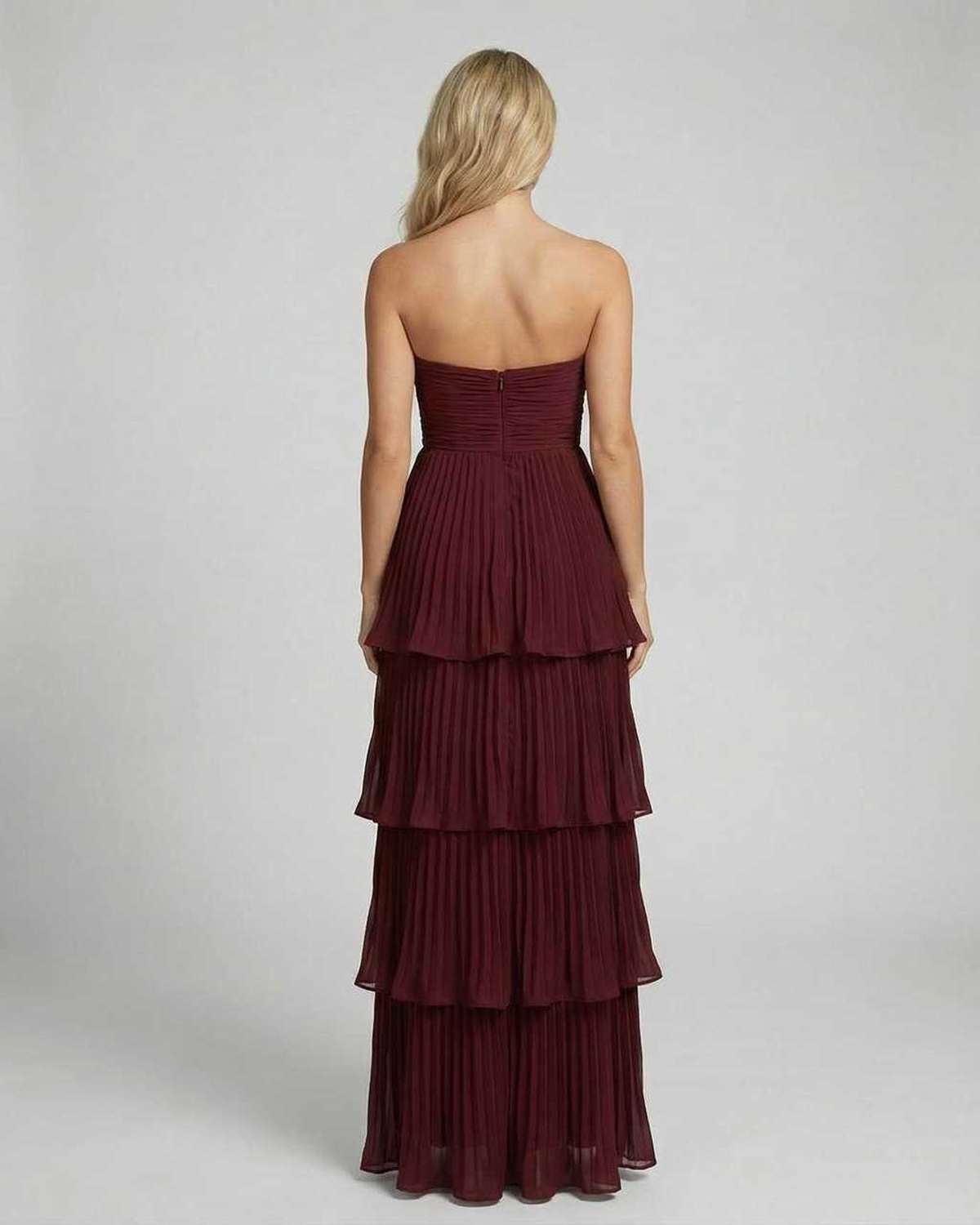 Back view of burgundy strapless maxi dress with smocked bodice and tiered layers