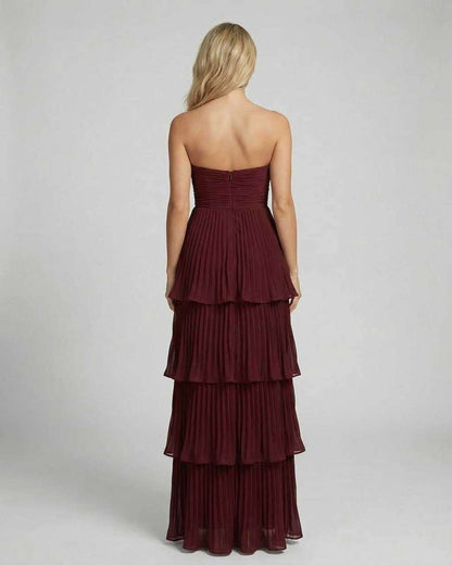 Back view of burgundy strapless maxi dress with smocked bodice and tiered layers