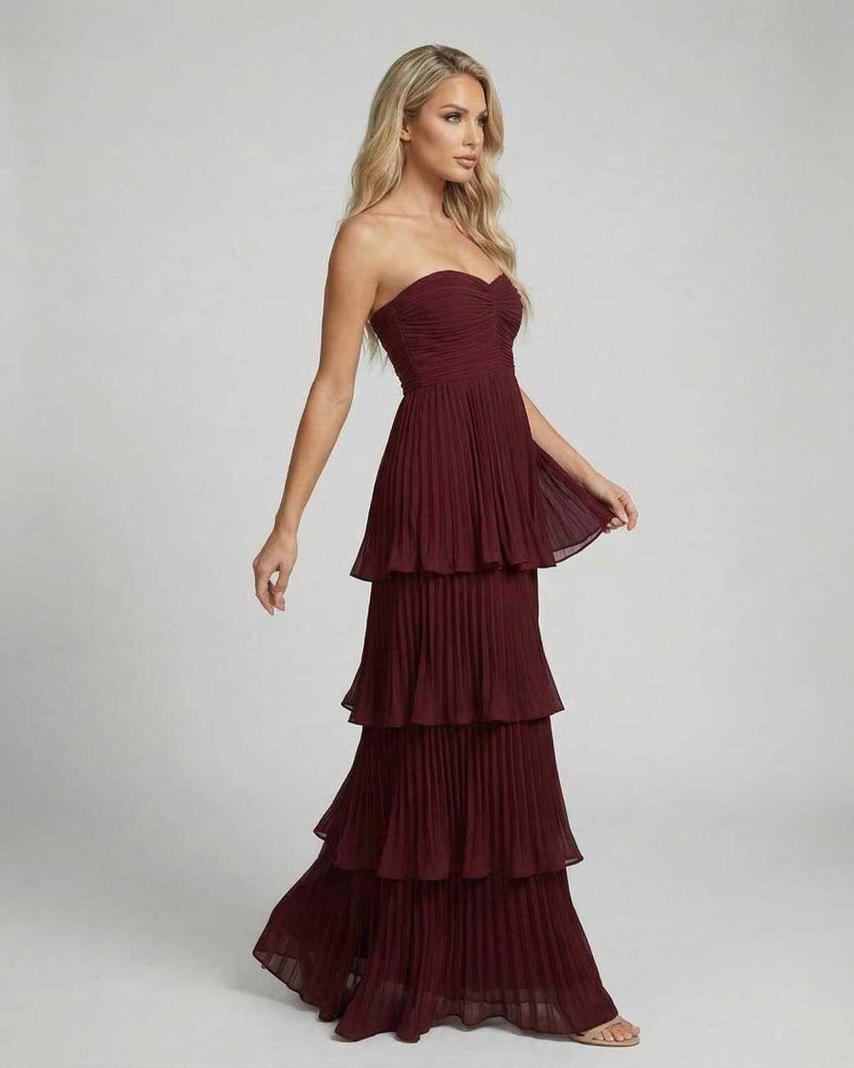 Burgundy strapless maxi dress with sweetheart neckline and layered pleated skirt
