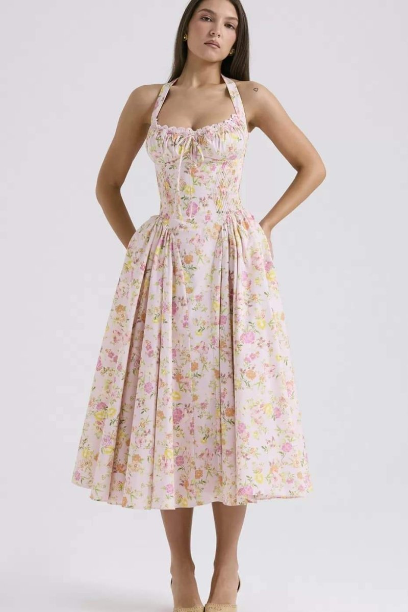 Pink floral halter midi dress with gathered bodice and wide skirt for a summer dress look