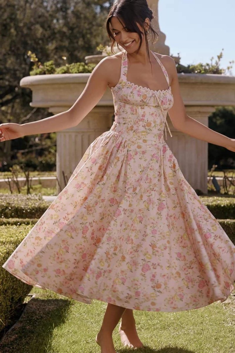 Pink floral halter midi dress with full skirt, ideal wedding guest dress for women