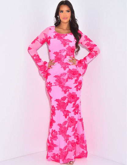 Pink floral long sleeve maxi dress with fitted silhouette and flared sleeves for wedding guest