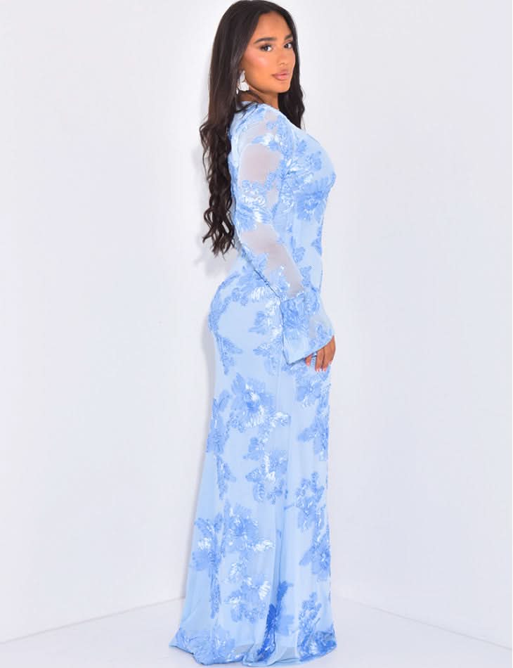 Side view of light blue floral maxi dress with sheer long sleeves and flared cuffs