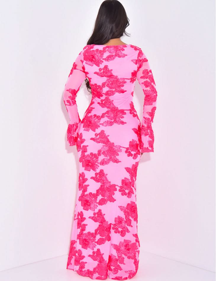Back view of pink floral long sleeve maxi dress with sheer mesh sleeves and flared cuffs