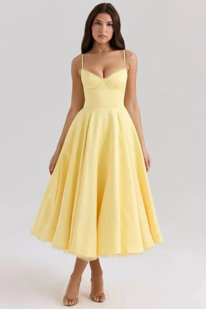 Front view of pale yellow midi dress with corset-style bodice and flared wedding guest skirt