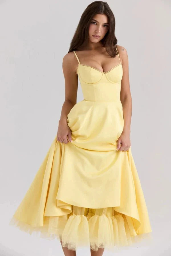 Yellow midi dress with sweetheart bust, fitted waist, and layered tulle hem for wedding guest wear
